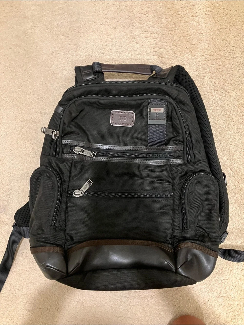 Tumi Black Backpack with Brown Trim and Leather Base